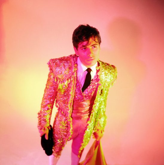 A James Bidgood Photograph from the 1960s of a young matador with yellow and pink tones