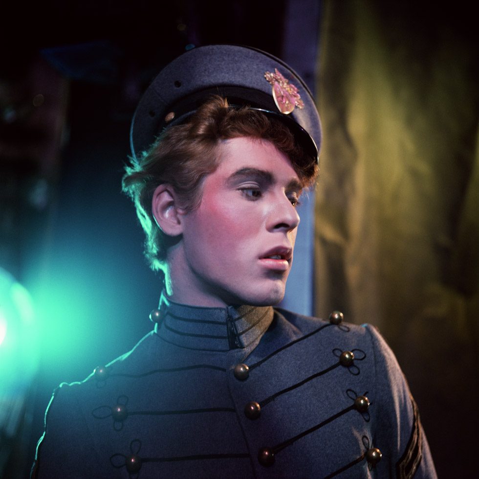 A photograph by James Bidgood of a handsome young cadet in a grey uniform