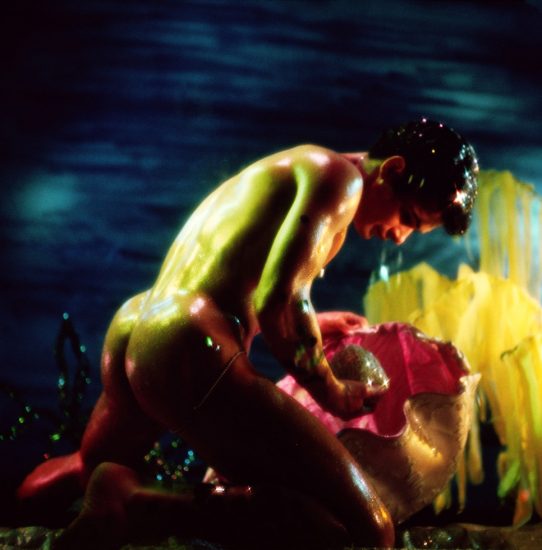 A James Bidgood photograph of Jay Garvin holding a large pearl underwater