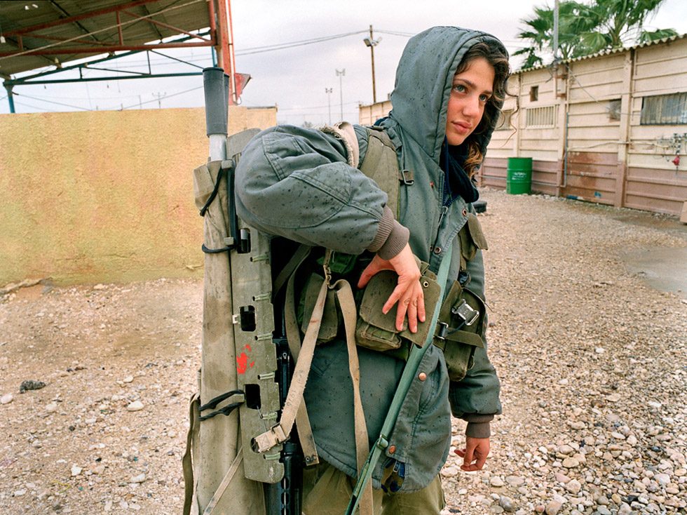 Carrying a stretcher in the rain by Rachel Papo