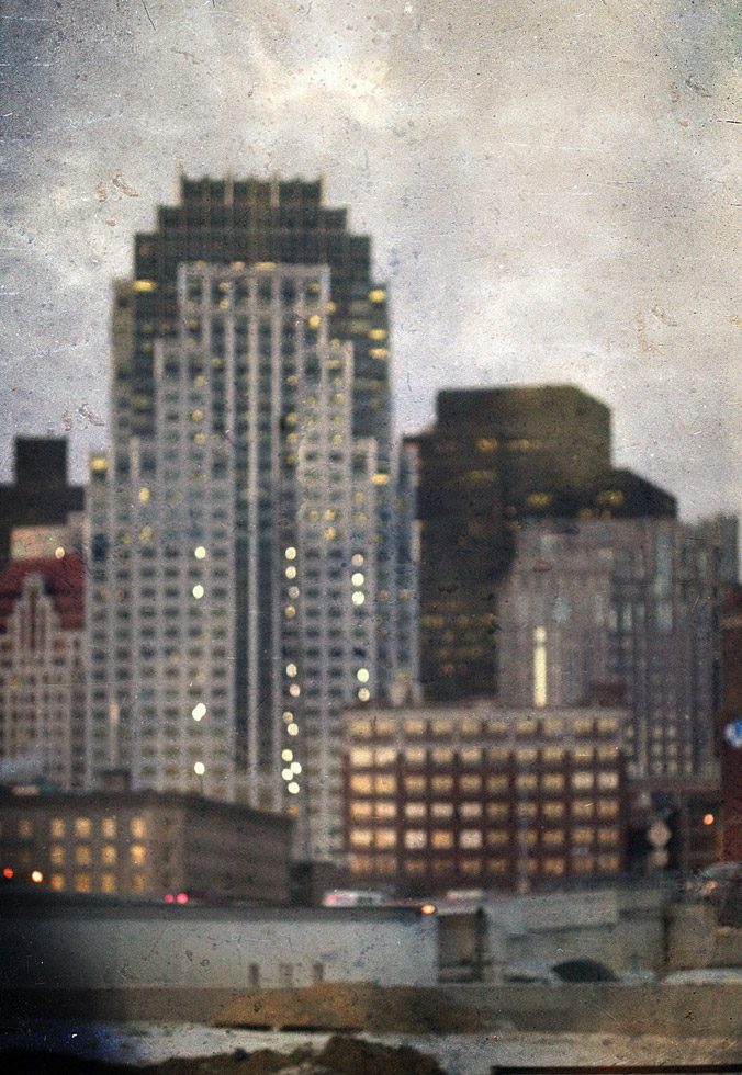 A soft focus photograph of buildings in Boston, MA