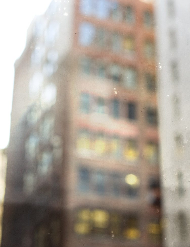 An out of focus photograph of a building in Chelsea New York