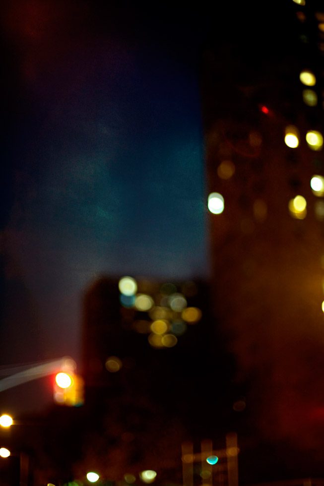 A soft focus photograph of a street in New York at night