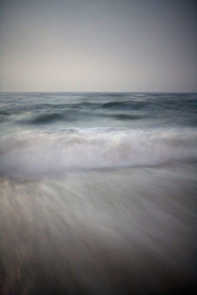 A soft focus photograph of waves in the ocean