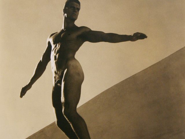 Photograph of a nude man with his arms outstretched