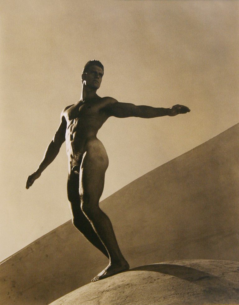 Photograph of a nude man with his arms outstretched