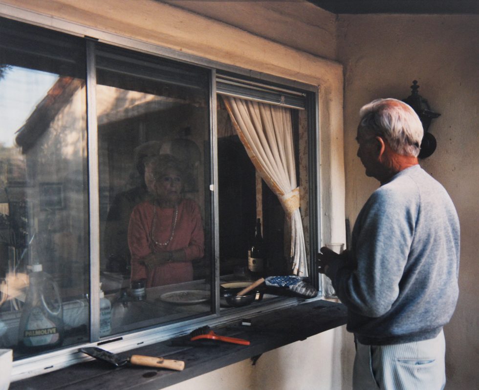 Conversation Through Kitchen Window (from “Pictures From Home”) by Larry Sultan