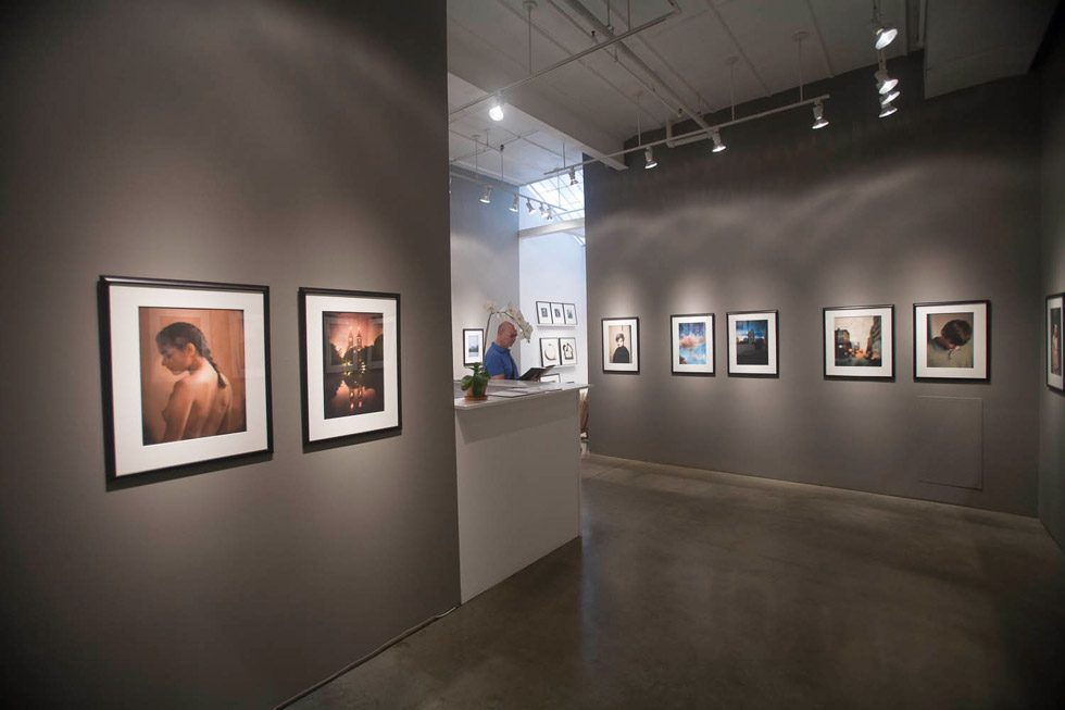 A photograph of Marc Yankus’ photographs on exhibit on display at Clamp