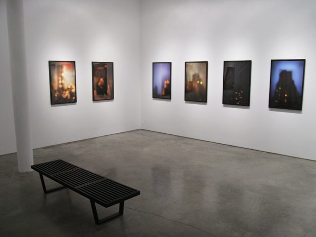 A photograph of Marc Yankus’ photographs on exhibit on display at Clamp