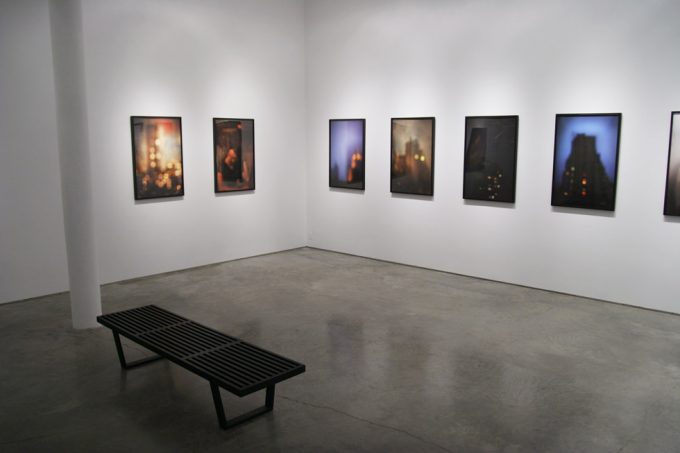 A photograph of Marc Yankus’ photographs on exhibit on display at Clamp