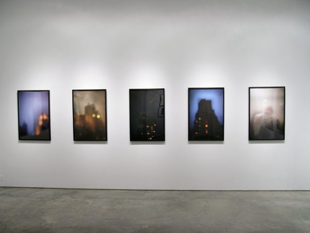 A photograph of Marc Yankus’ photographs on exhibit on display at Clamp