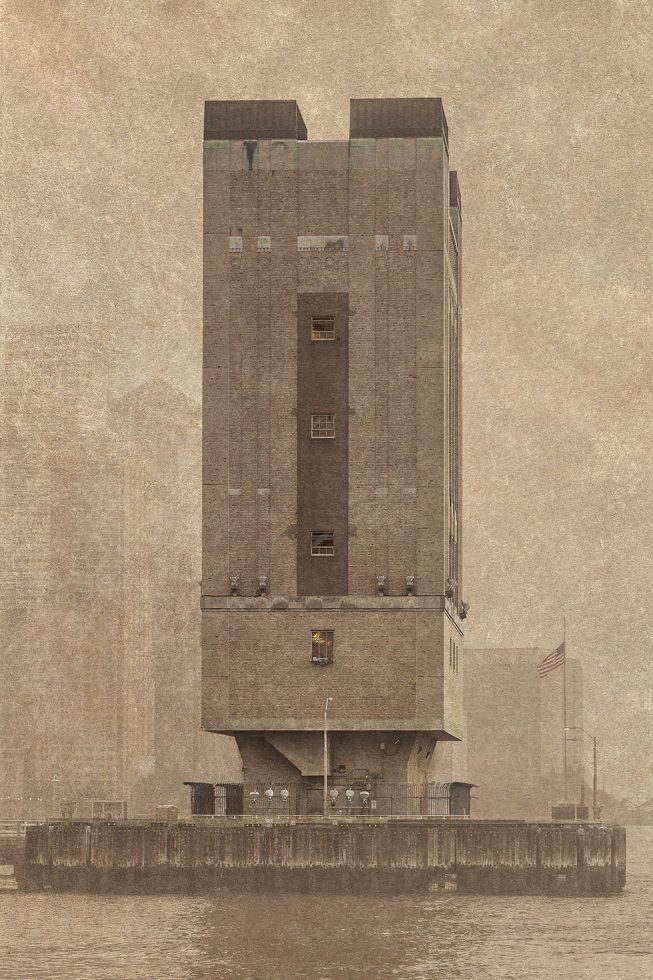 A photograph of a Holland Tunnel Tower in the Hudson River