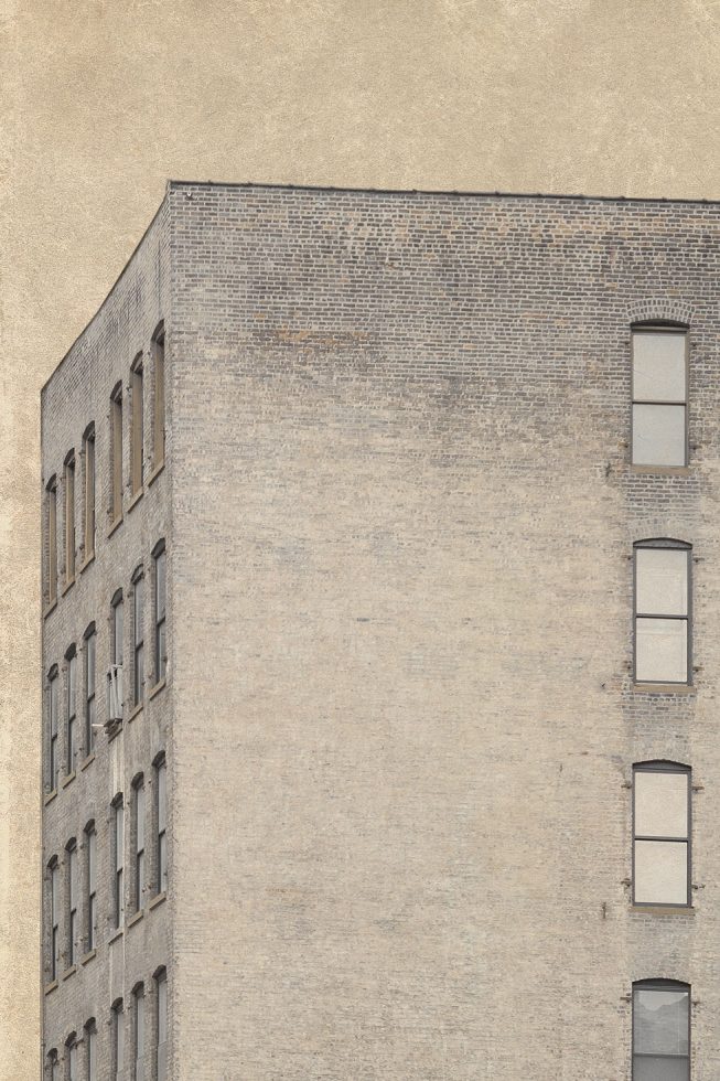 A hazy photograph of a the side of a brick building