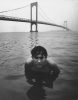 Boy in Water Under Bridge