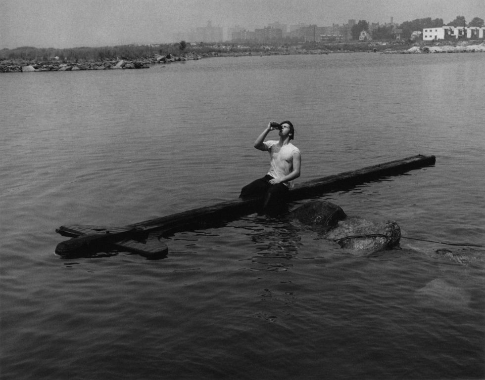 Teenager Drinking on Telephone Pole by Arthur Tress