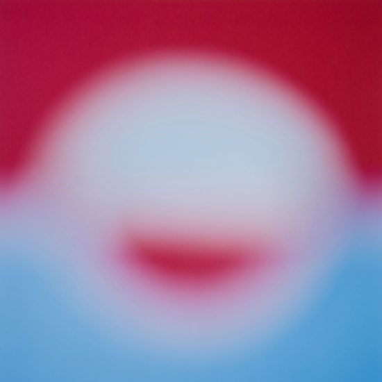 An blurry abstracted shape rendered in white, red, and blue.