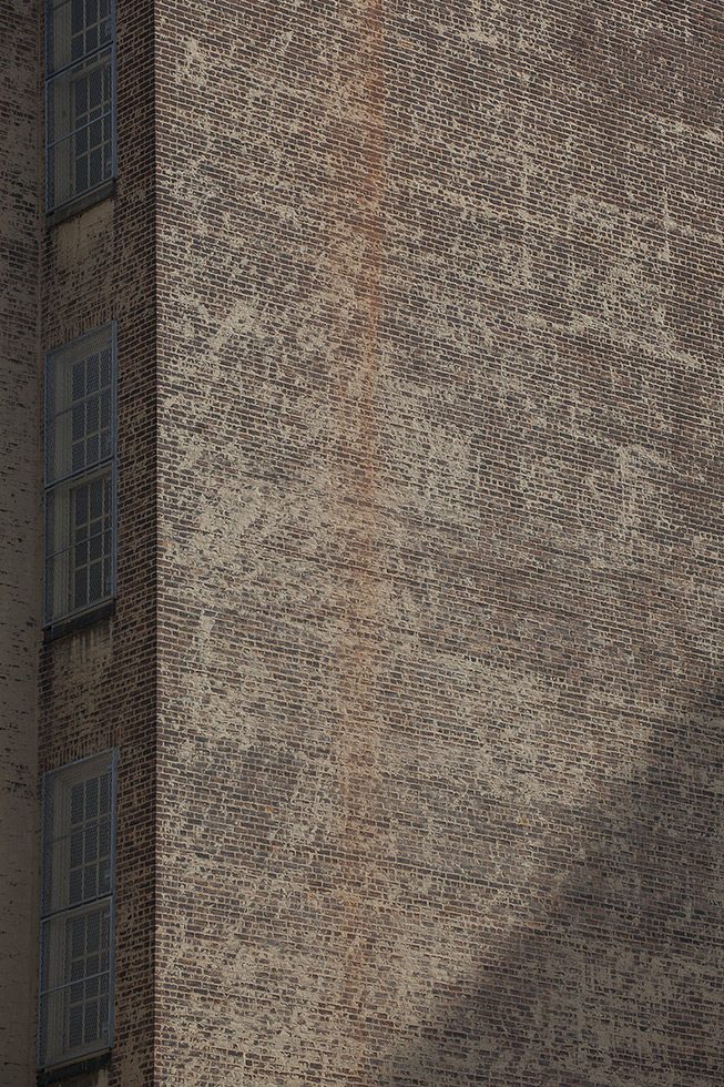 A photograph of the side of a brick building in New York City