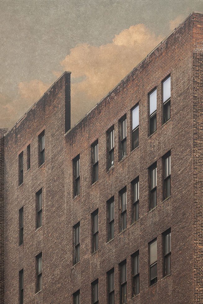 A photograph of the facade of a brick building in New York