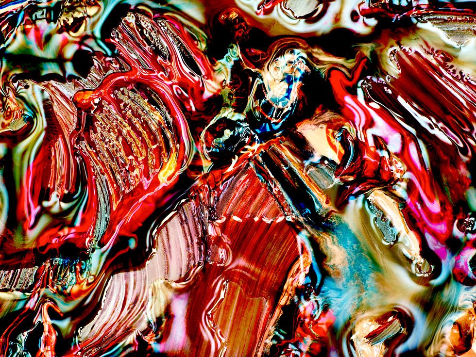 This is an image of a close-up of an abstract painting with wild colors and broad brushstrokes.