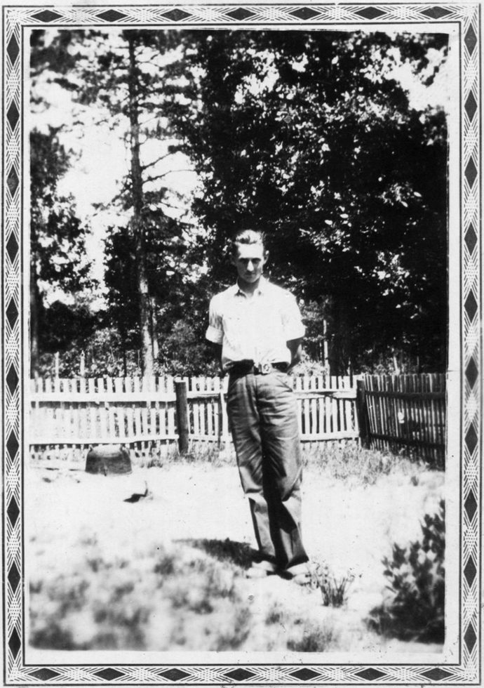 Untitled (Man in front of fence) by Mike Disfarmer