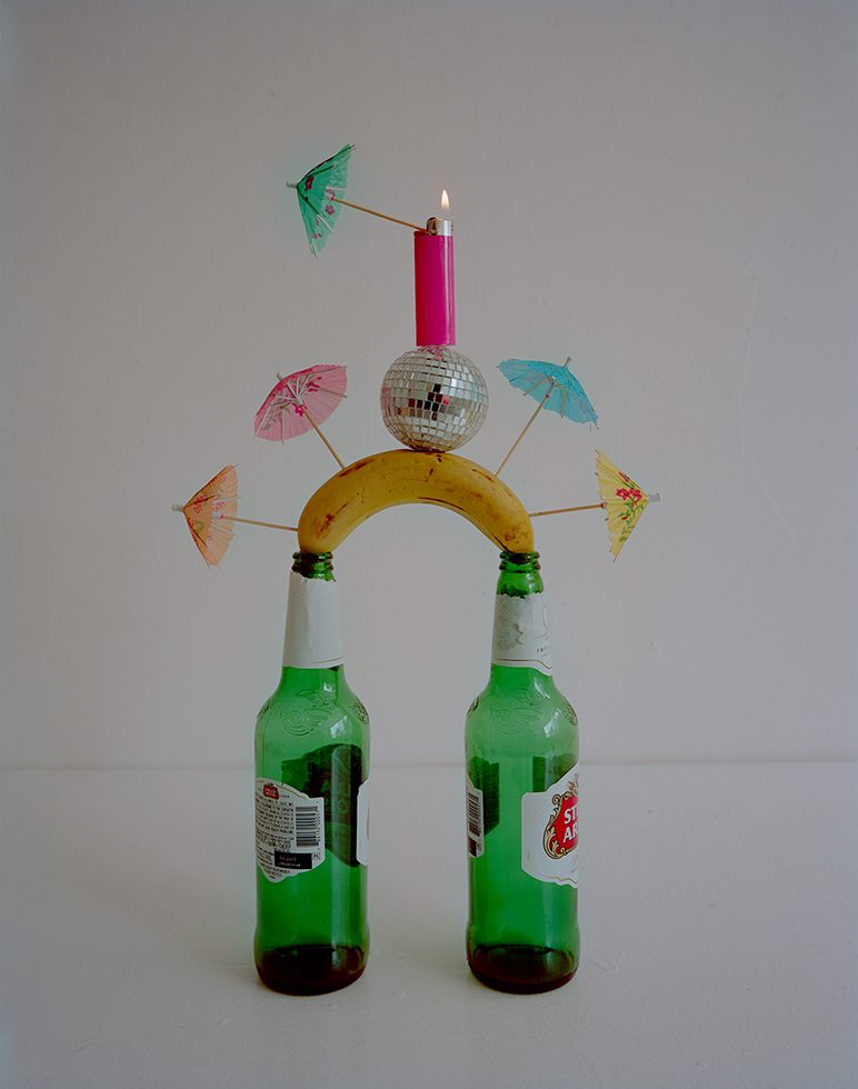 Beer Bottles, Toilet Paper Rolls, Masking Tape, Disco Ball, Bic Lighter and Cock by Adam Ekberg