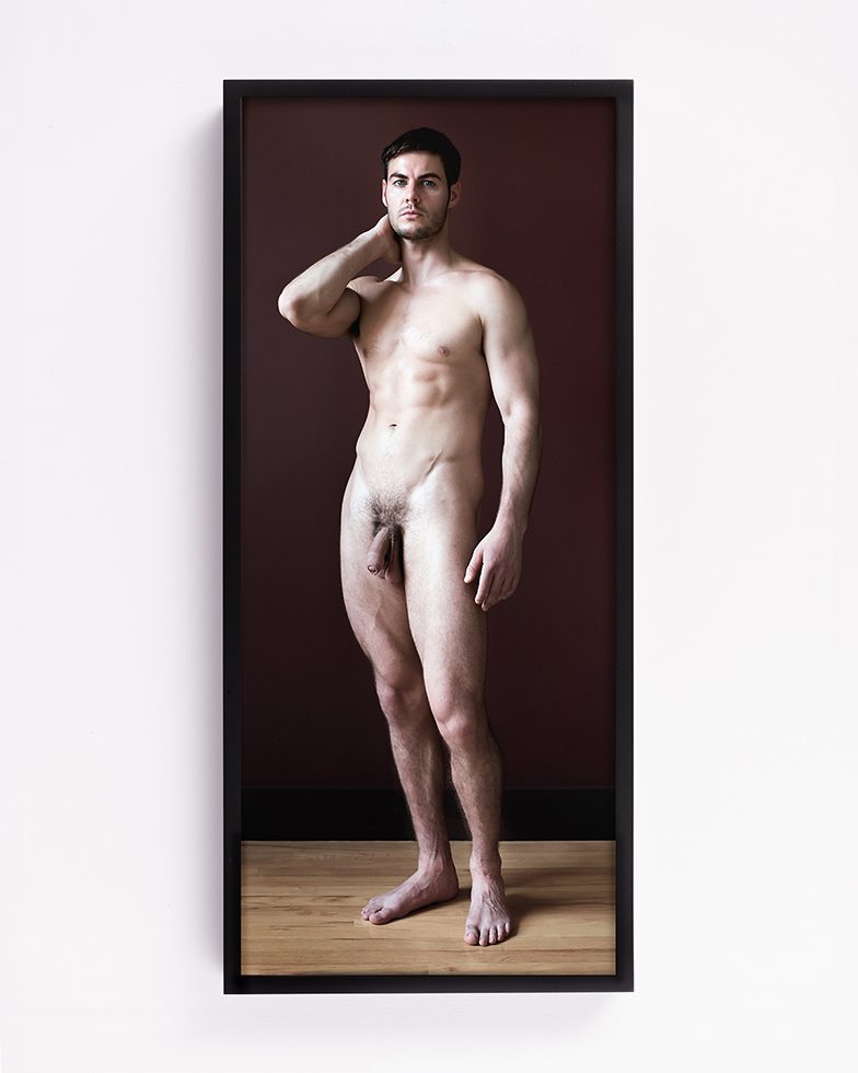 This is a full length photograph of a standing male nude.