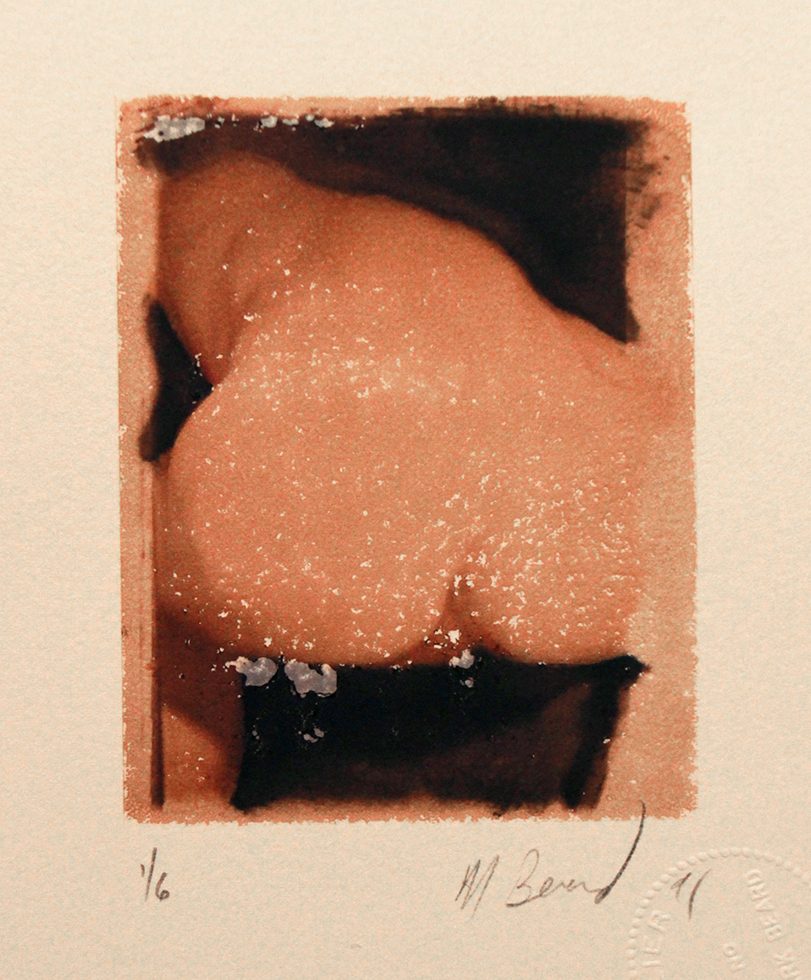 This is a color Polaroid of a naked man bending over with his bottom facing the camera.