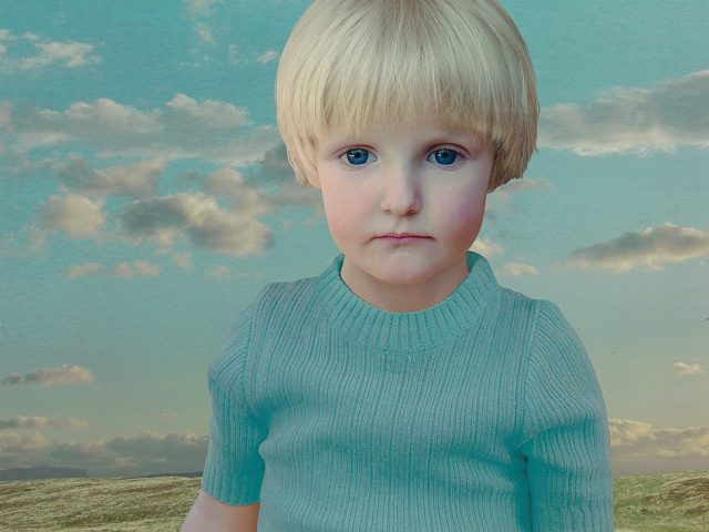 This is a digitally manipulated color photograph of a blonde child in a turquoise-colored shirt against a landscape.