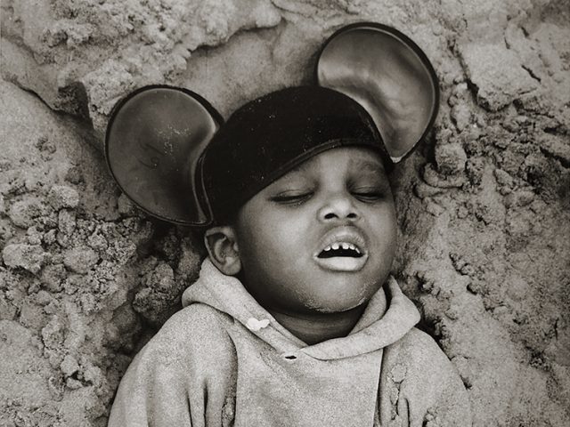 Arthur Tress, Boy in Mickey Mouse Hat, Coney Island, New York