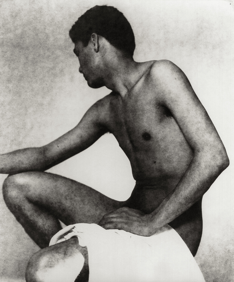 J.J. Ynocencio sitting looking away from the camera with a towel over his thigh