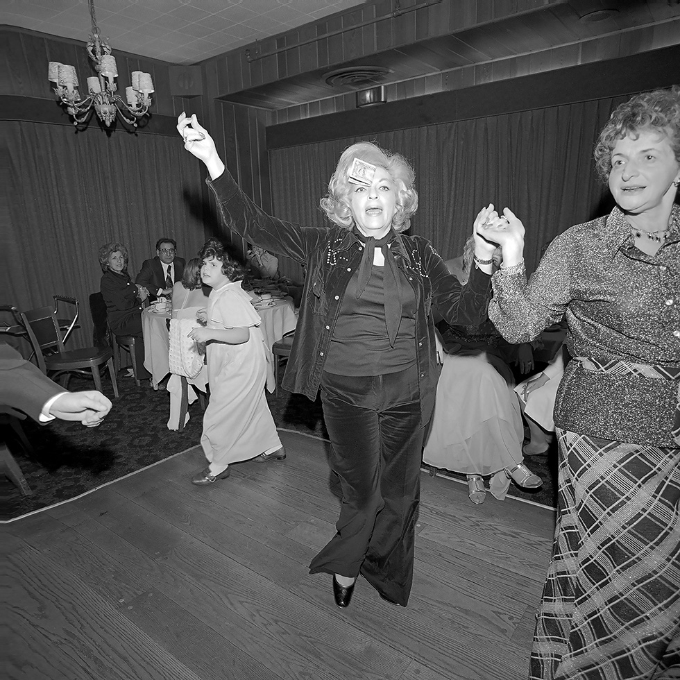 Mom Dances with a Dollar on her Forehead at a Wedding by Meryl Meisler