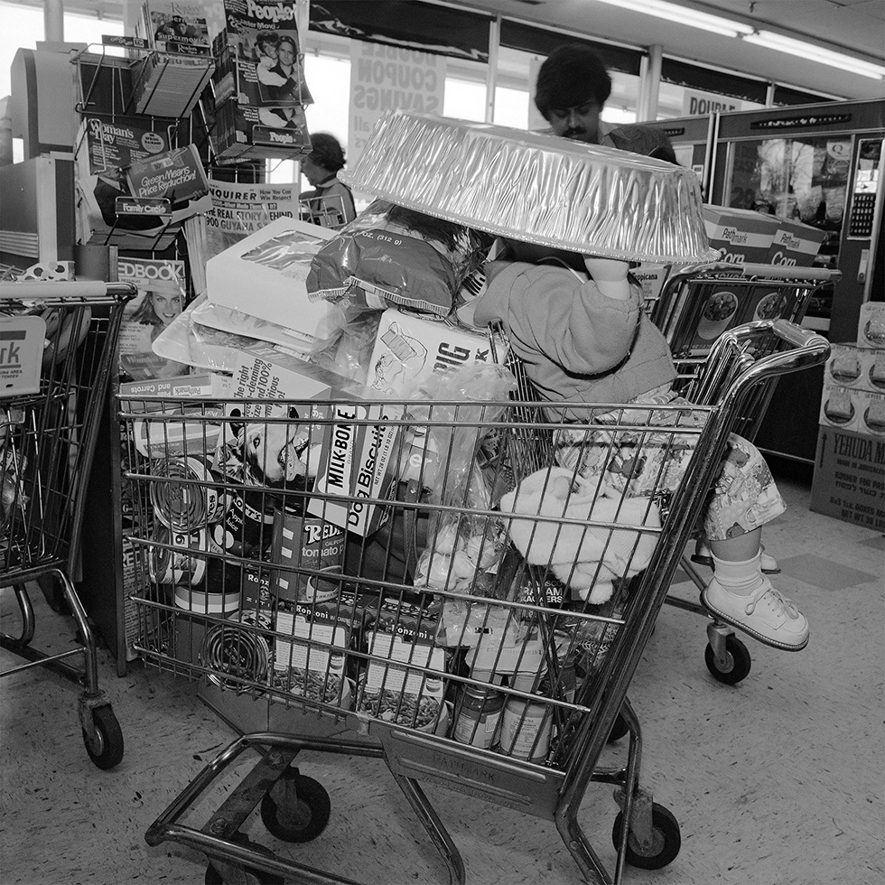 Toddler in Shopping Cart by Meryl Meisler