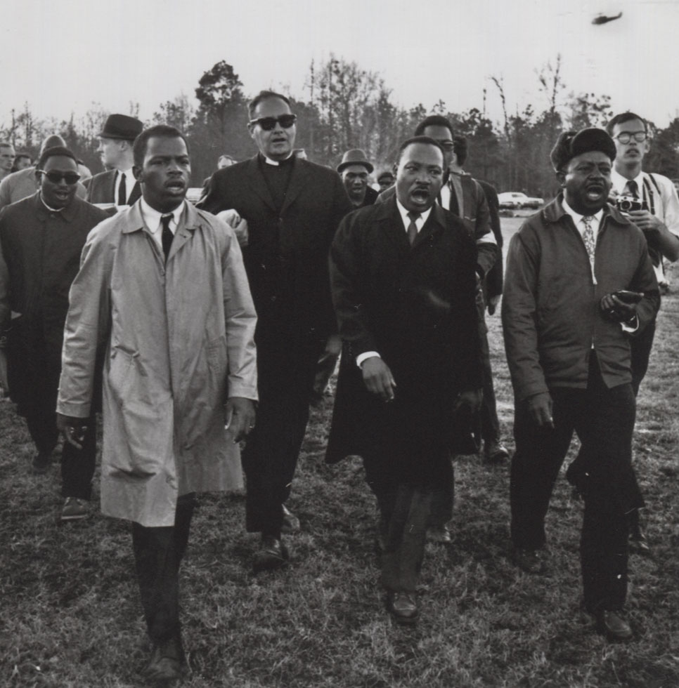 A black-and-white photo by Harry Benson of Martin Luther King during the James Meredith March Against Fear.