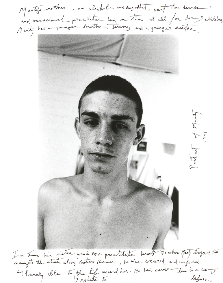 This is a black-and-white portrait of a shirtless young man with extensive handwritten text around the image.