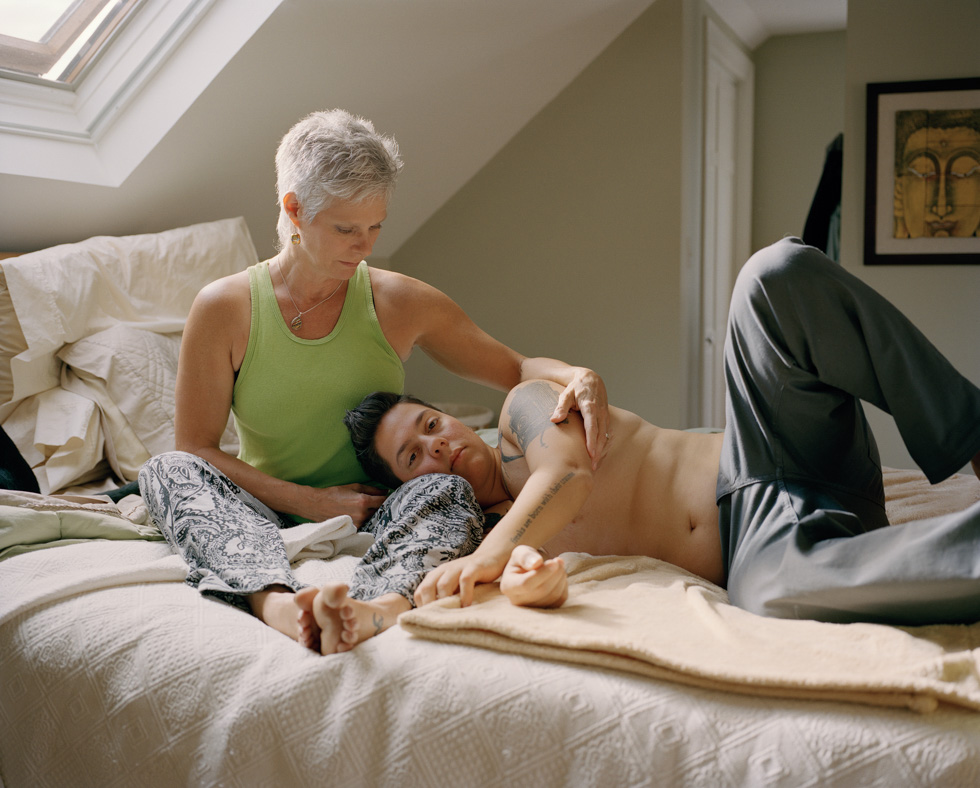 Jess T. Dugan, Self-portrait with mom (bed), 2012