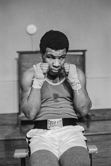 Lori Grinker, Mike Tyson, 14, does sits up at Cus D’Amato’s Boxing Gym in Catskill, NY