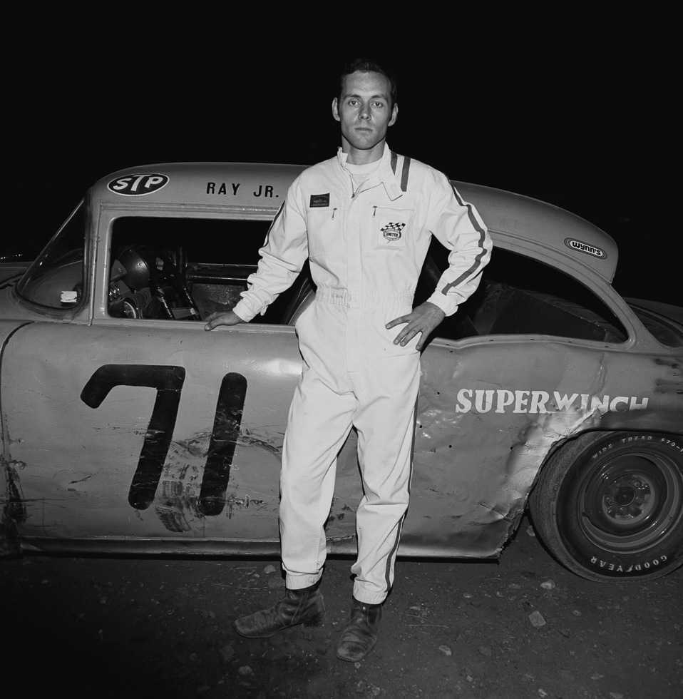 A black and white photograph taken by Henry Horenstein in 1972 at the Thomson Speedway in Thomson, Connecticut in 1972.