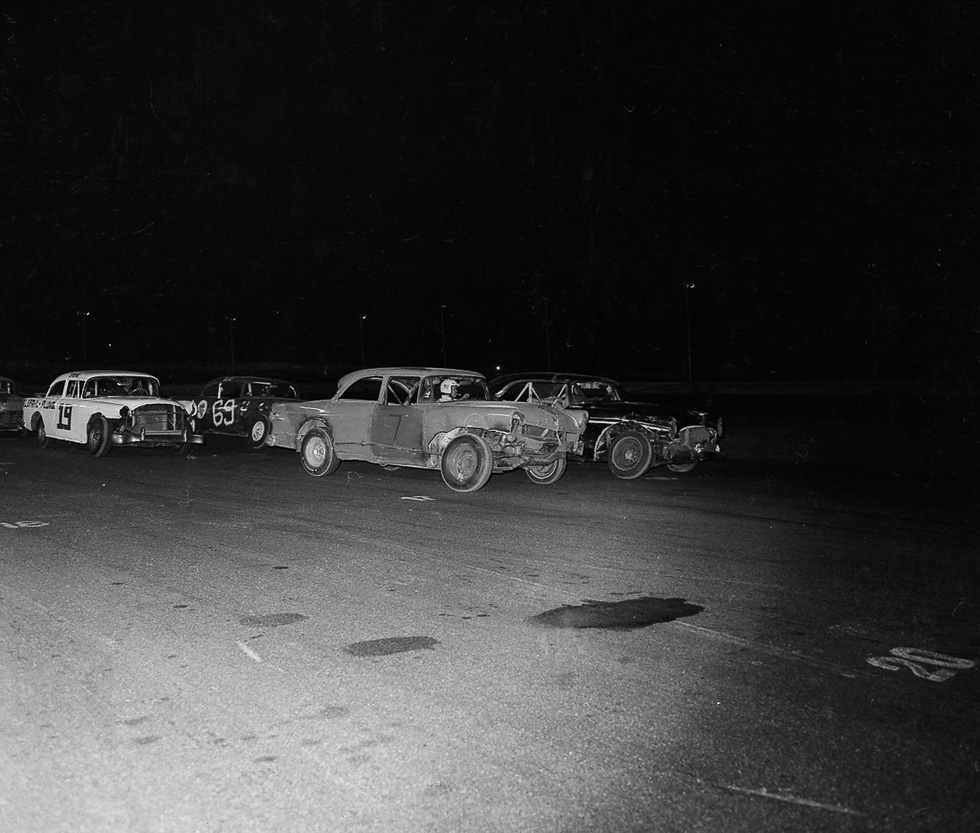 A black and white photograph taken by Henry Horenstein in 1972 at the Thomson Speedway in Thomson, Connecticut in 1972.