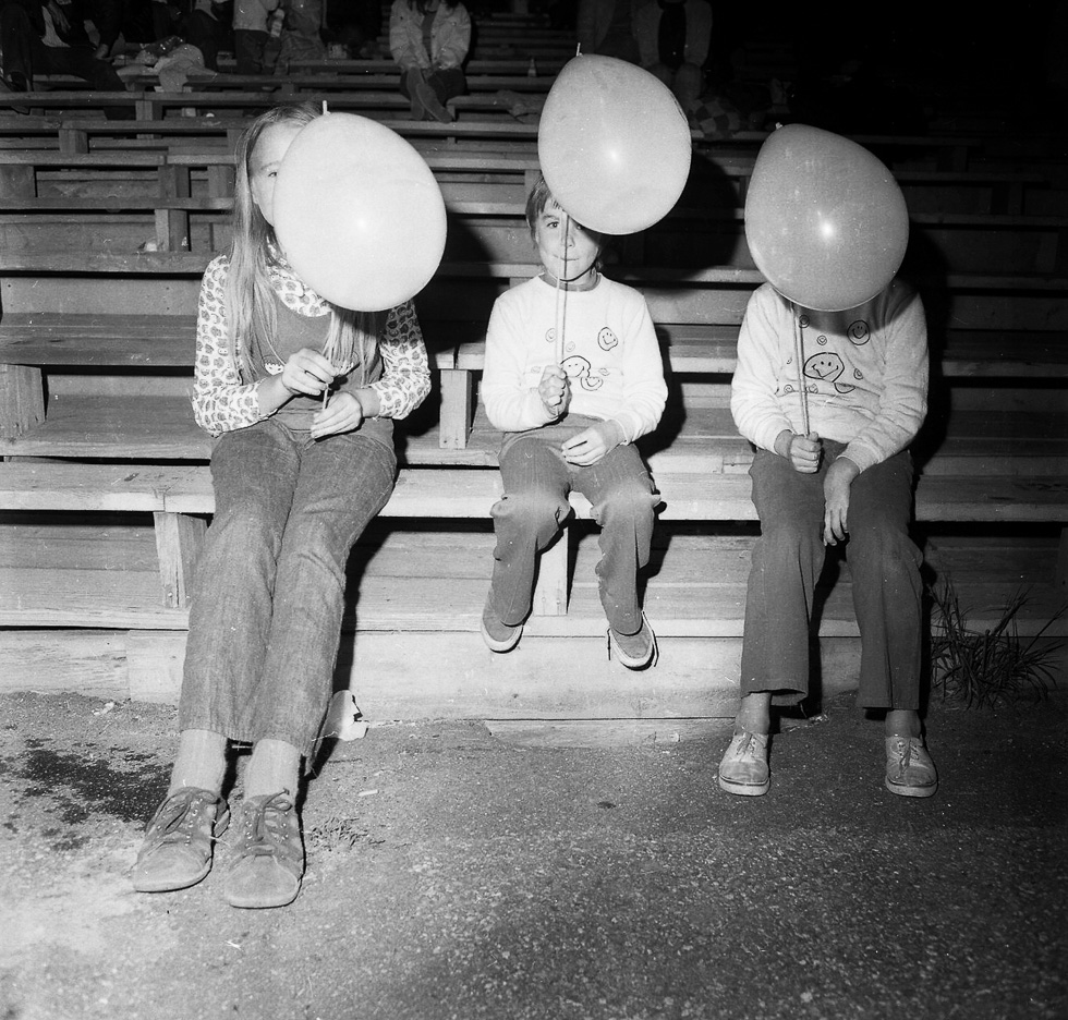 A black and white photograph taken by Henry Horenstein in 1972 at the Thomson Speedway in Thomson, Connecticut in 1972.