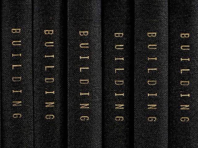 This is a photograph of black book spines which all say "BUILDING," taken by artist Mickey Smith.