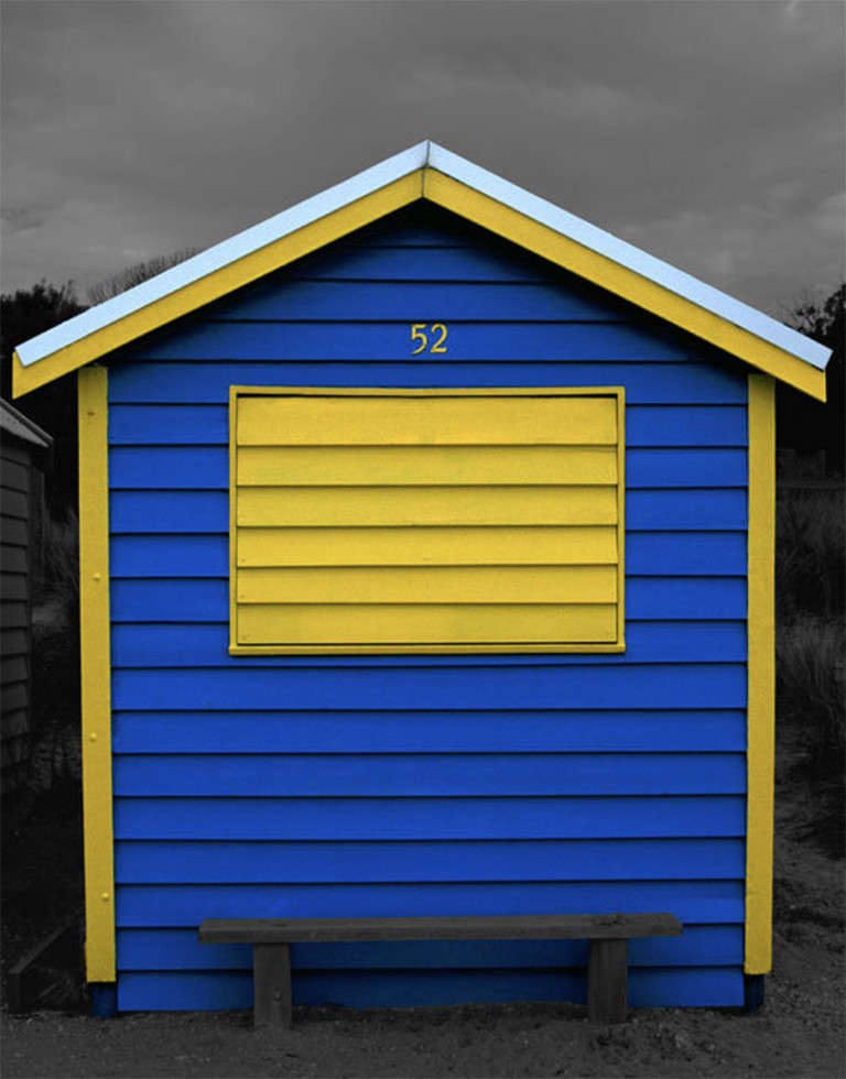 This is a photograph by Judy Gelles of an Australian Beach Box that is blue and yellow.