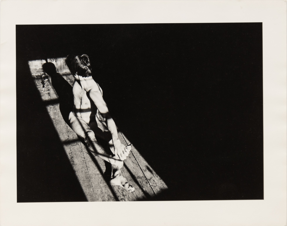 This is a vintage black and white photograph by Curtice Taylor of Alan nude in a Barn.