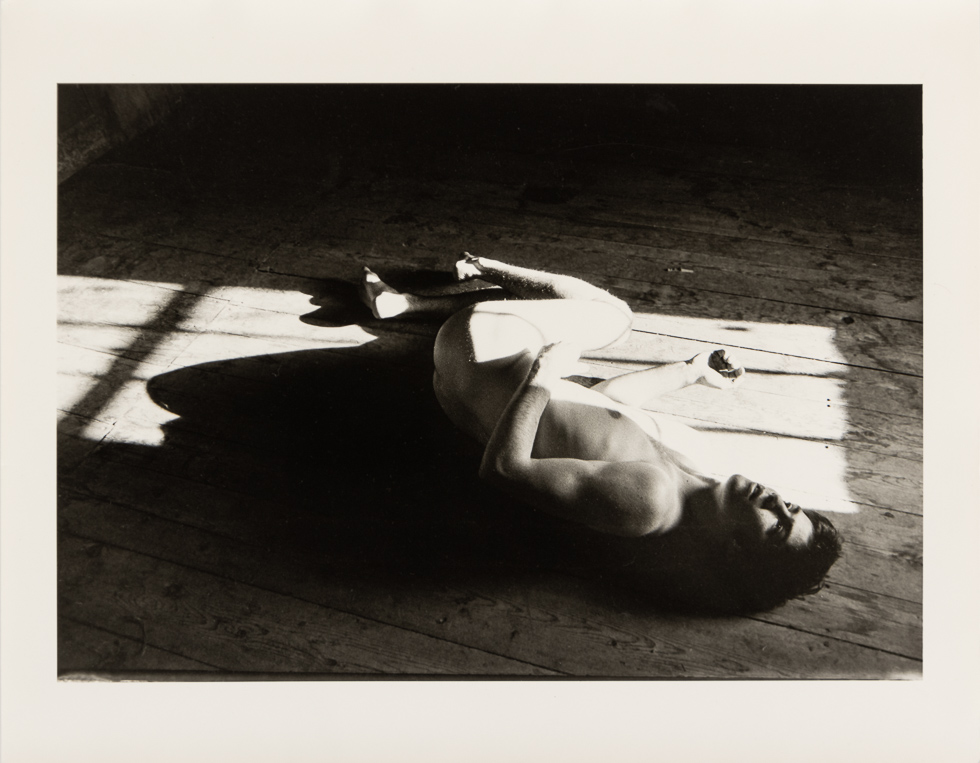 This is a vintage black and white photograph by Curtice Taylor of Alan nude in a Barn.