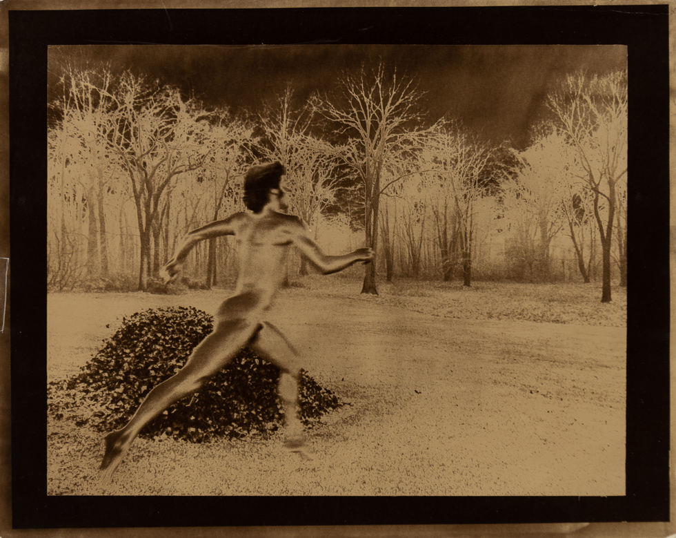 This is a solarized copper tone photograph by Curtice Taylor of Alan Running Naked in Rye, NY 1974.