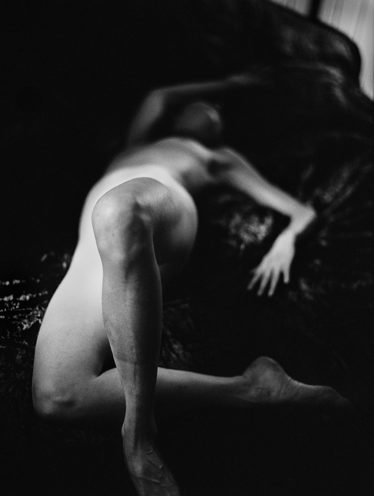 This is a black and white female nude portrait.