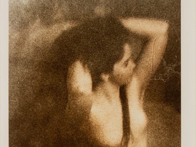 Click for sizes / editions / prices. This is a photograph of a nude woman posing with her hands in her hair.