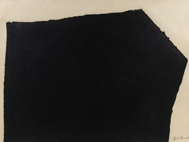 This is an abstract artwork etching by Richard Serra titled Hreppholar VII (Berswordt/Wallrabe 80; G. 1), 1991 that has a black geometric form against a blank white backdrop.