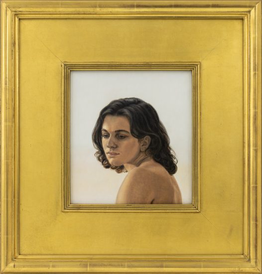 This is a painting in a wide gold frame of a boy with long hair in three-quarter profile.