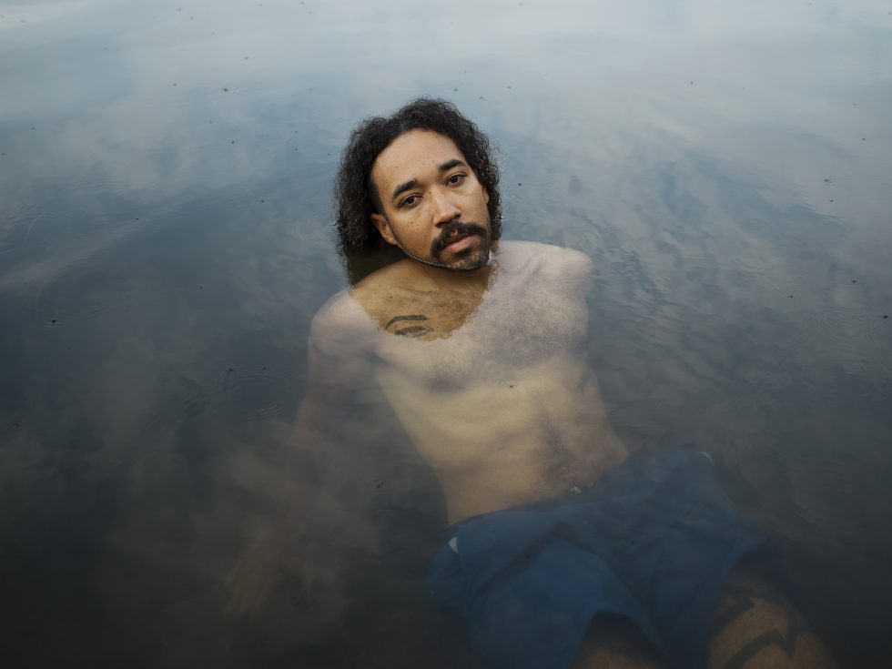 This is a photograph of a person in a pool of water.