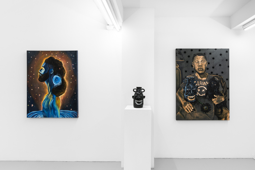 This is a photograph of paintings by Anthony Peyton Young on view at CLAMP in New York City.